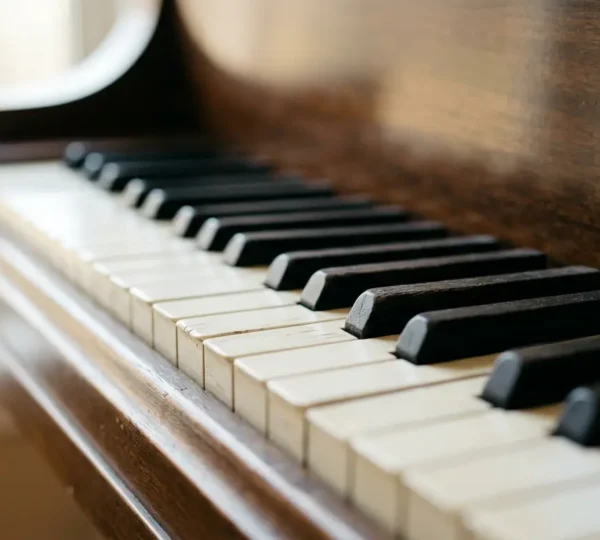 Close-up of piano keys with soft natural lighting showing sophisticated harmonic texture