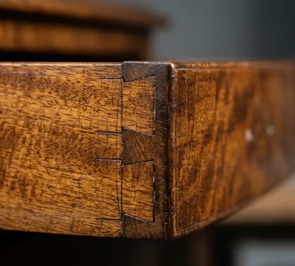 Close-up detail of Georgian-era hand-cut joinery showcasing precision craftsmanship and authentic patina
