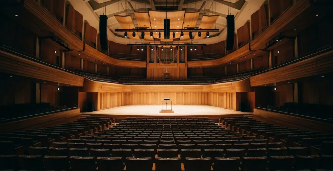 Wide-angle view of a concert hall interior showing the relationship between a soloist position and audience space, illustrating acoustic projection principles