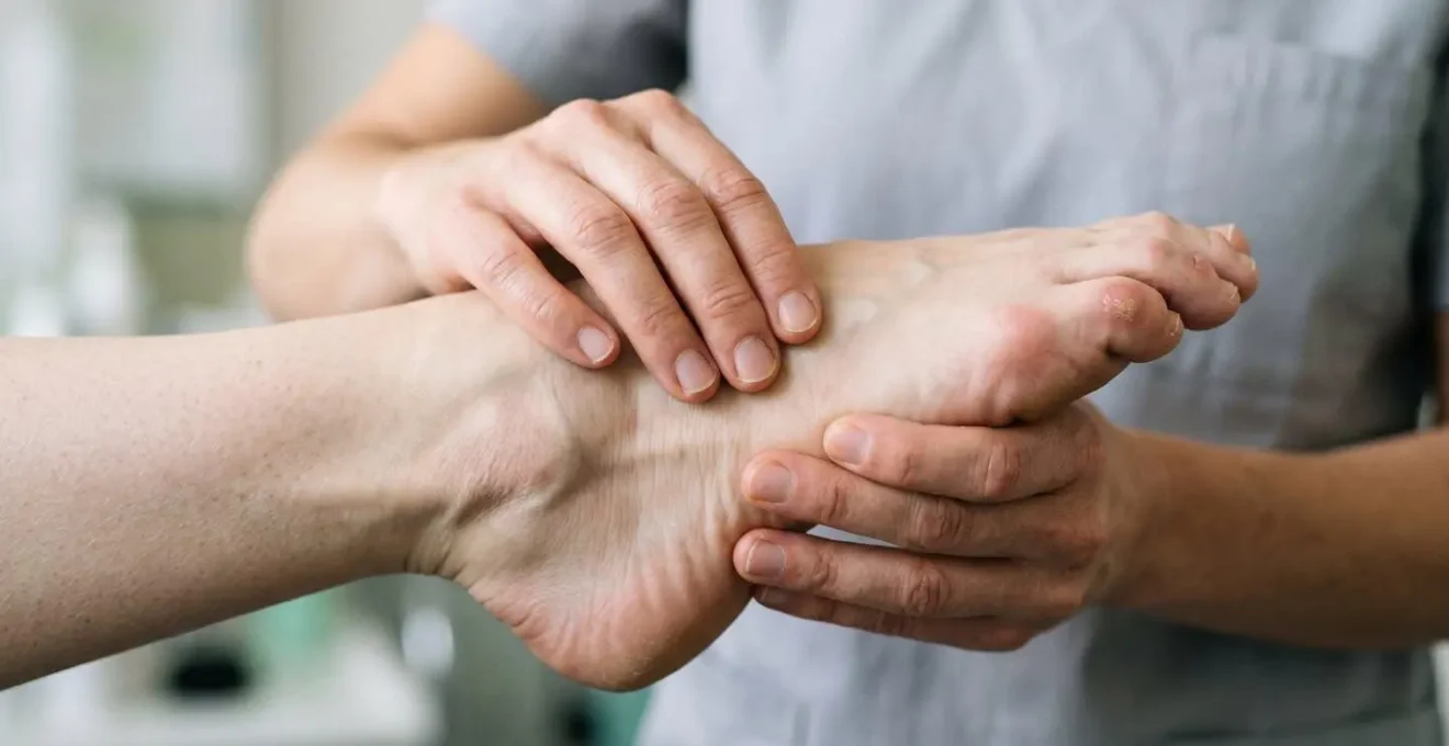 Close-up of ballet dancer's foot and ankle during professional assessment