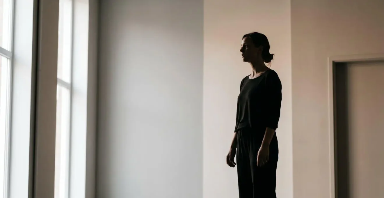 Environmental shot showing singer's silhouette with emphasis on released neck and jaw posture